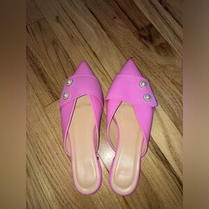 Pink flats with pearl accents